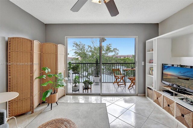 13701 SW 12th St Unit 310A, Pembroke Pines, FL 33027 - entryway featuring a ceiling fan, tile patterned flooring, and a textured ceiling