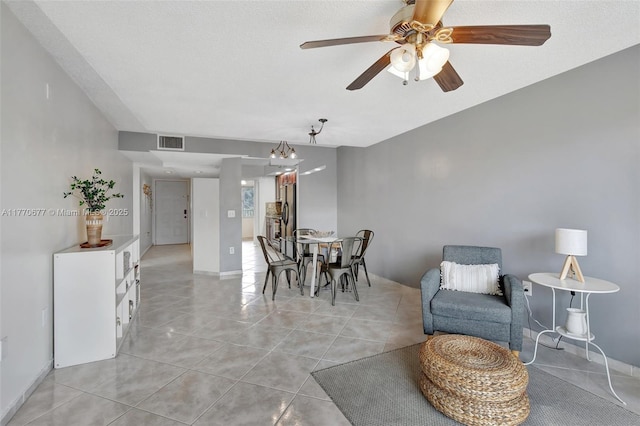 13701 SW 12th St Unit 310A, Pembroke Pines, FL 33027 - dining room with light tile patterned floors, a ceiling fan, and baseboards