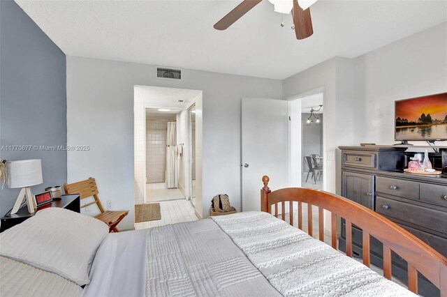 13701 SW 12th St Unit 310A, Pembroke Pines, FL 33027 - bedroom with a ceiling fan and ensuite bath
