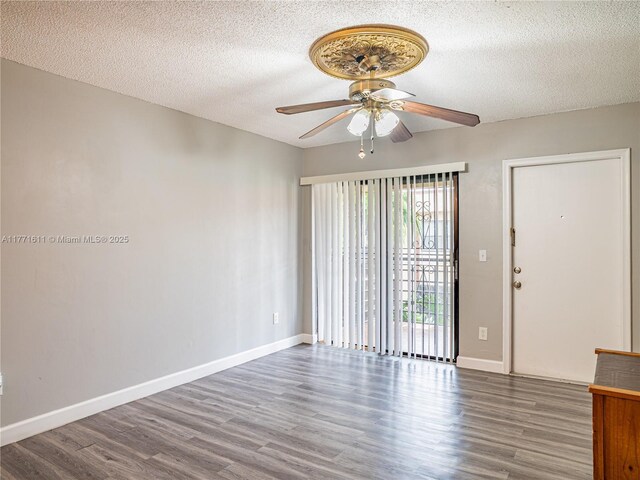 6545 W 27th Ct Unit 24-47, Hialeah, FL 33016 - spare room featuring a ceiling fan, wood finished floors, and a textured ceiling