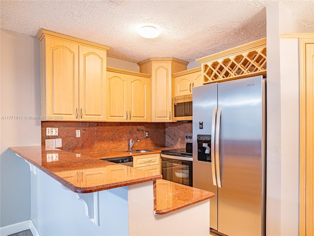 6545 W 27th Ct Unit 24-47, Hialeah, FL 33016 - kitchen featuring appliances with stainless steel finishes, a peninsula, light stone countertops, backsplash, and a textured ceiling