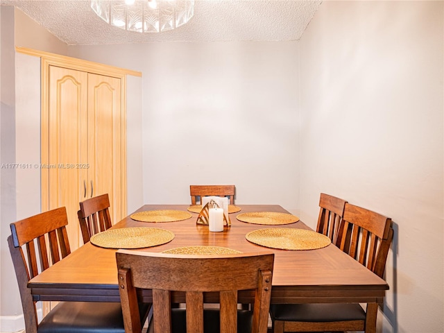 6545 W 27th Ct Unit 24-47, Hialeah, FL 33016 - dining space featuring a textured ceiling
