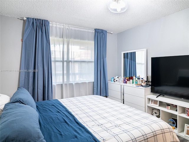 6545 W 27th Ct Unit 24-47, Hialeah, FL 33016 - bedroom featuring a textured ceiling