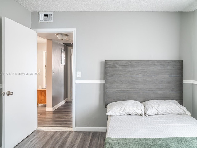 6545 W 27th Ct Unit 24-47, Hialeah, FL 33016 - bedroom with wood finished floors and a textured ceiling