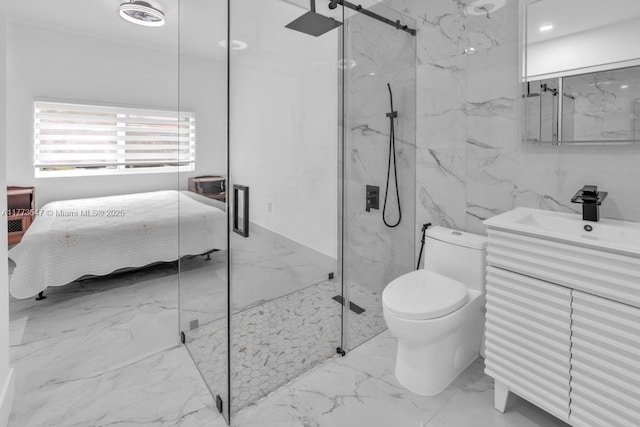 bathroom featuring vanity, marble finish floor, a marble finish shower, and toilet