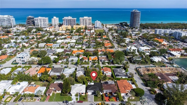 aerial view featuring a water view, a city view, and a residential view