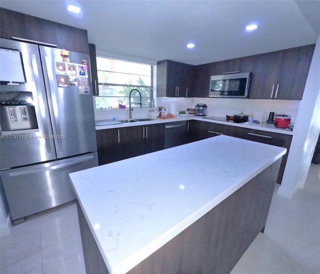 8920 Palm Tree Ln Unit 8920, Pembroke Pines, FL 33024 - kitchen with stainless steel appliances, modern cabinets, light countertops, dark brown cabinetry, and recessed lighting