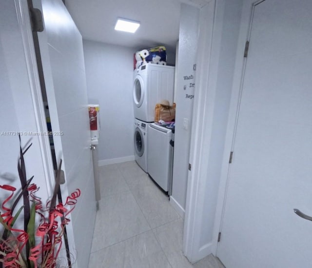 8920 Palm Tree Ln Unit 8920, Pembroke Pines, FL 33024 - washroom featuring stacked washer / drying machine and light tile patterned floors