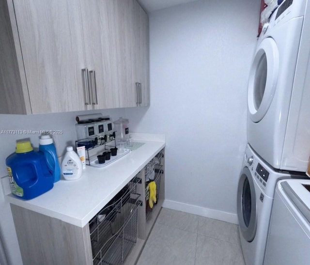 8920 Palm Tree Ln Unit 8920, Pembroke Pines, FL 33024 - laundry area with stacked washer and clothes dryer, cabinet space, and light tile patterned floors