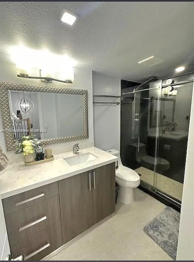 8920 Palm Tree Ln Unit 8920, Pembroke Pines, FL 33024 - bathroom with vanity, a shower stall, and a textured ceiling