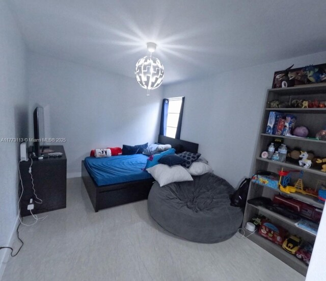 8920 Palm Tree Ln Unit 8920, Pembroke Pines, FL 33024 - bedroom featuring a chandelier