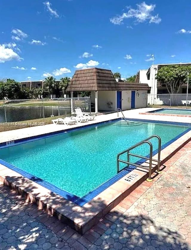 8920 Palm Tree Ln Unit 8920, Pembroke Pines, FL 33024 - community pool featuring a patio