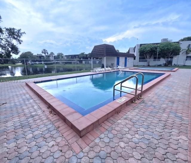 8920 Palm Tree Ln Unit 8920, Pembroke Pines, FL 33024 - community pool with a patio area