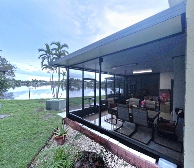 8920 Palm Tree Ln Unit 8920, Pembroke Pines, FL 33024 - view of patio / terrace featuring a water view and a sunroom