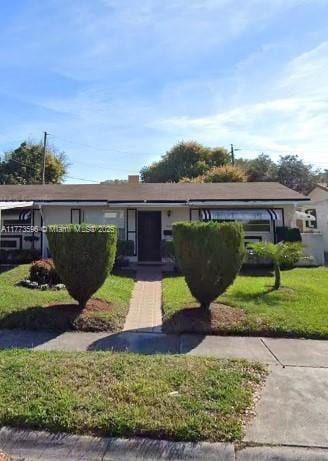 1010 NW 57th St, Miami, FL 33127 - ranch-style home with a front lawn