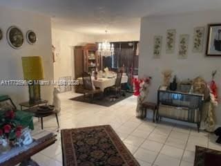 1010 NW 57th St, Miami, FL 33127 - living room with a chandelier and tile patterned flooring