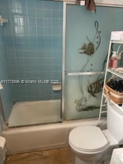 1010 NW 57th St, Miami, FL 33127 - full bath with combined bath / shower with glass door and toilet