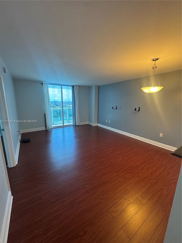 1800 N Bayshore Dr Unit 1404, Miami, FL 33132 - empty room with dark wood-style floors and baseboards
