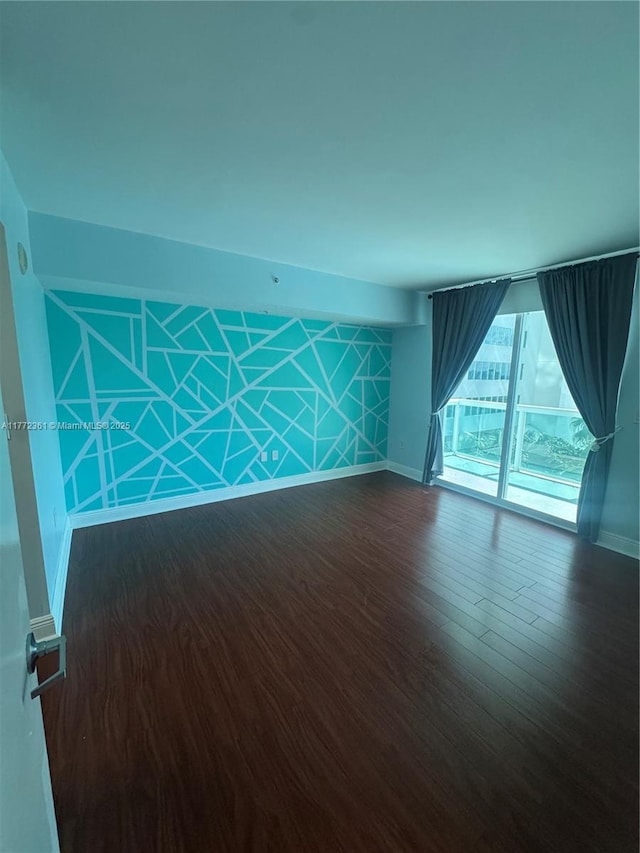 1800 N Bayshore Dr Unit 1404, Miami, FL 33132 - spare room with baseboards and dark wood finished floors