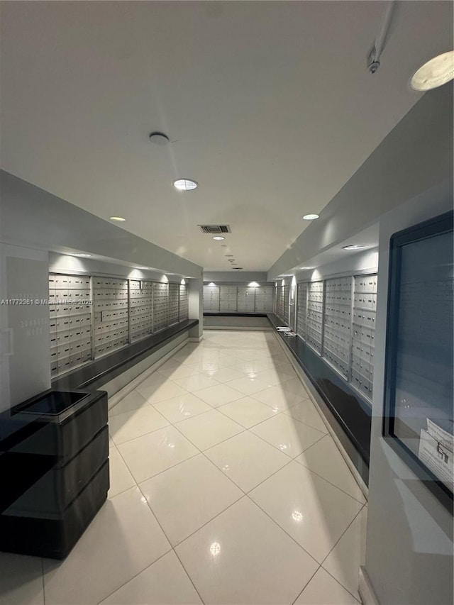 1800 N Bayshore Dr Unit 1404, Miami, FL 33132 - hallway featuring mail area and light tile patterned floors