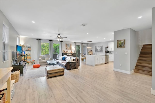 709 SW 17th St, Fort Lauderdale, FL 33315 - living room with recessed lighting, stairway, light wood-style flooring, and ceiling fan