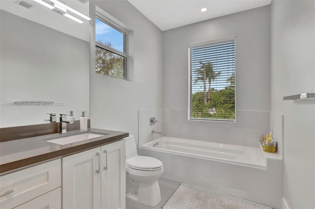 709 SW 17th St, Fort Lauderdale, FL 33315 - bathroom with toilet, visible vents, a bath, tile patterned flooring, and vanity