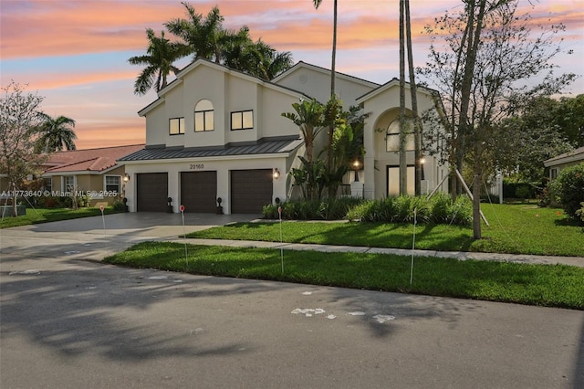 20160 NW 9th Dr, Pembroke Pines, FL 33029 - view of front of property with a garage, concrete driveway, stucco siding, a yard, and a standing seam roof