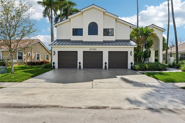 20160 NW 9th Dr, Pembroke Pines, FL 33029 - view of front of home with a garage, a standing seam roof, and stucco siding