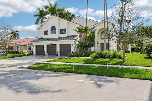 20160 NW 9th Dr, Pembroke Pines, FL 33029 - view of front facade featuring an attached garage, driveway, stucco siding, a front lawn, and a standing seam roof