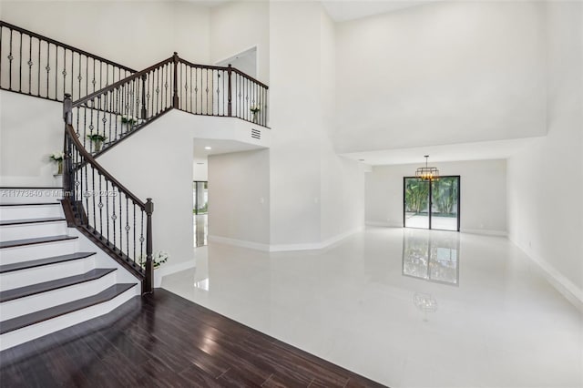 20160 NW 9th Dr, Pembroke Pines, FL 33029 - staircase with a chandelier and a towering ceiling