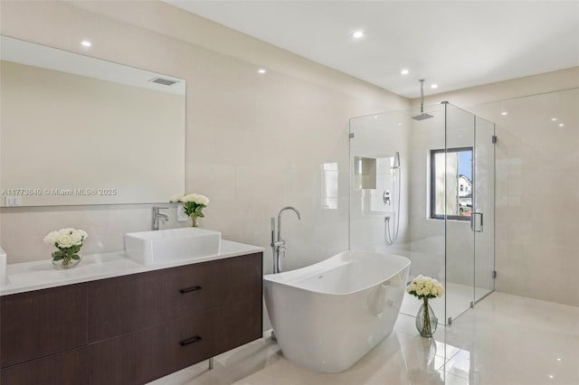 20160 NW 9th Dr, Pembroke Pines, FL 33029 - full bathroom featuring a stall shower, vanity, a freestanding bath, tile patterned flooring, and recessed lighting
