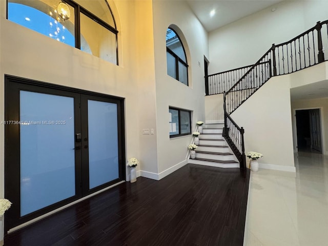 20160 NW 9th Dr, Pembroke Pines, FL 33029 - entryway featuring a high ceiling, a chandelier, stairway, wood finished floors, and recessed lighting