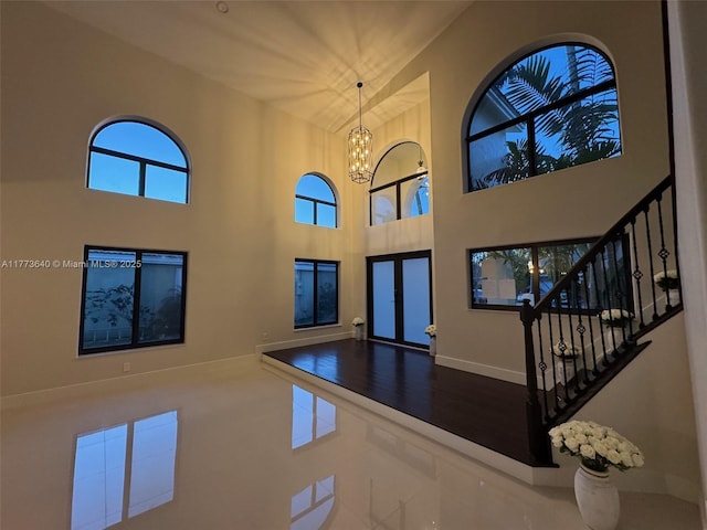 20160 NW 9th Dr, Pembroke Pines, FL 33029 - foyer entrance with a high ceiling, a chandelier, and stairway