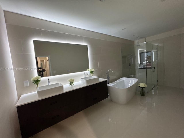 20160 NW 9th Dr, Pembroke Pines, FL 33029 - full bathroom featuring walk in shower, double vanity, a freestanding bath, and tile walls