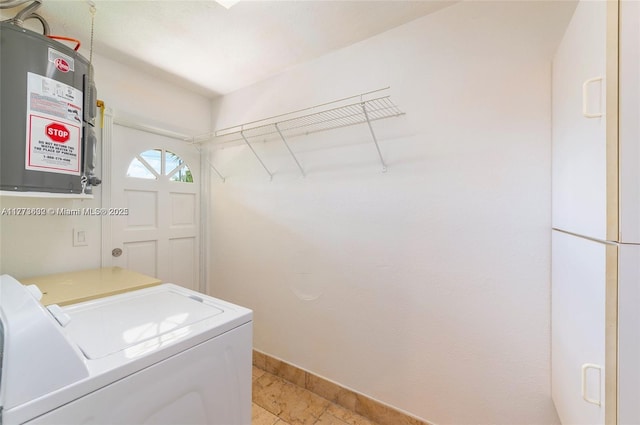 219 NE 11th Ave Unit 2, Hallandale Beach, FL 33009 - laundry area featuring water heater, washer and clothes dryer, baseboards, and laundry area