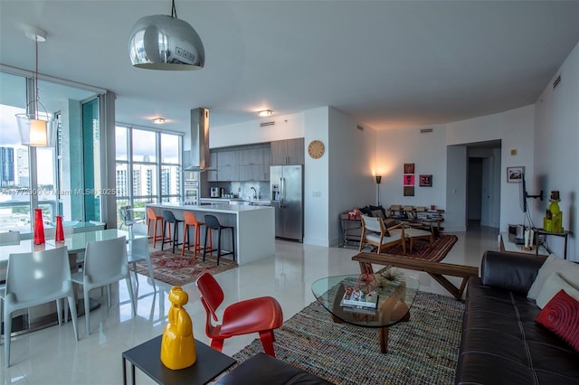 3131 NE 188th St Unit 2-1002, Aventura, FL 33180 - living room with a wall of windows and light tile patterned flooring