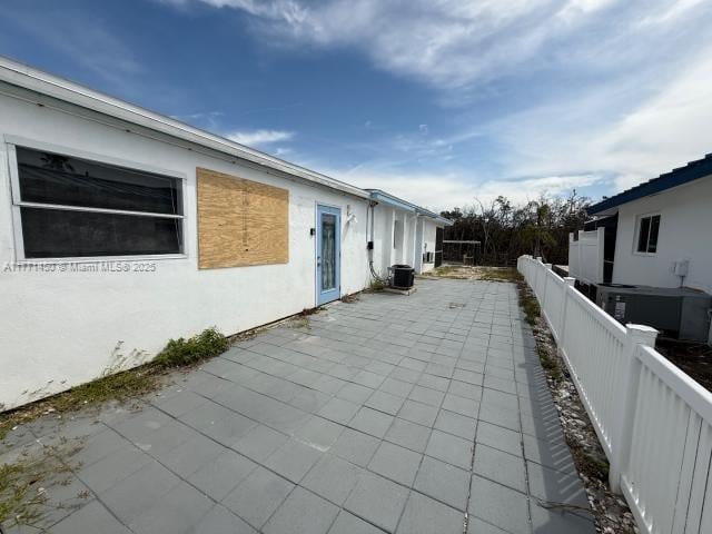 view of patio / terrace featuring a fenced backyard and central AC