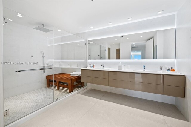 9601 Collins Ave Unit 1506, Bal Harbour, FL 33154 - full bath with double vanity, a sink, a stall shower, and tile patterned flooring