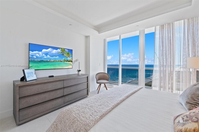 9601 Collins Ave Unit 1506, Bal Harbour, FL 33154 - bedroom featuring a tray ceiling and access to exterior