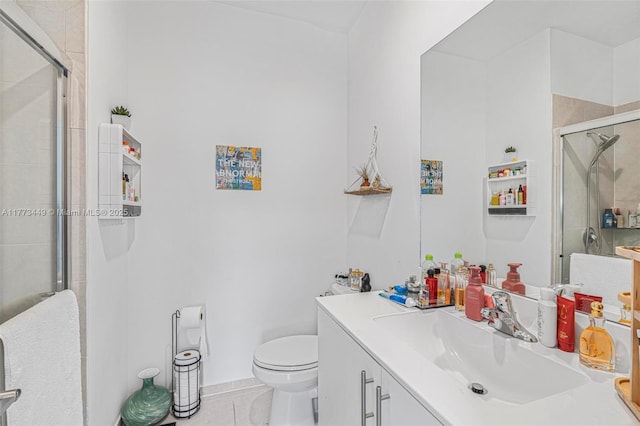 full bath with vanity, toilet, tile patterned floors, and a stall shower