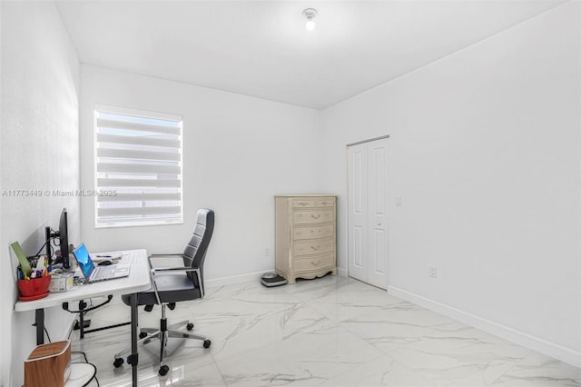 office with baseboards and marble finish floor