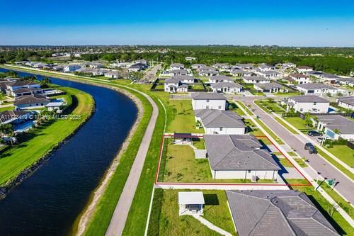 drone / aerial view with a water view and a residential view