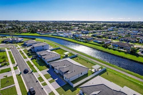 bird's eye view featuring a water view and a residential view