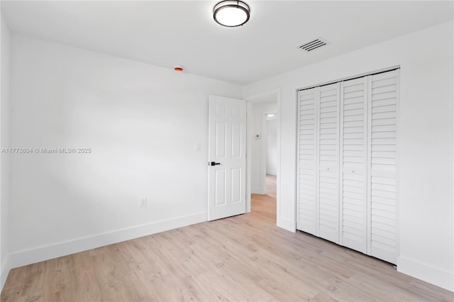 601 NW 35th Ter, Lauderhill, FL 33311 - unfurnished bedroom with wood finished floors, visible vents, and baseboards