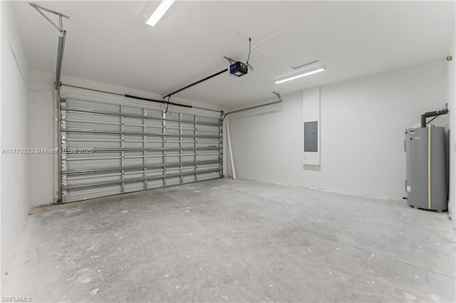 garage featuring water heater, electric panel, and a garage door opener