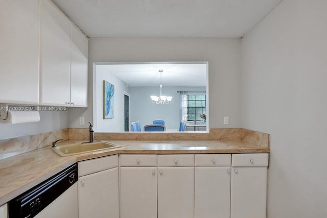 kitchen with white dishwasher, light countertops, a sink, and an inviting chandelier