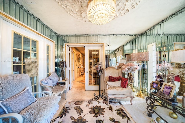 85 NW 165th St, Miami, FL 33169 - sitting room featuring an inviting chandelier, tile patterned flooring, and french doors