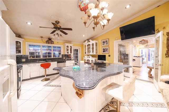 85 NW 165th St, Miami, FL 33169 - kitchen featuring range, crown molding, dishwasher, lofted ceiling, and light tile patterned floors