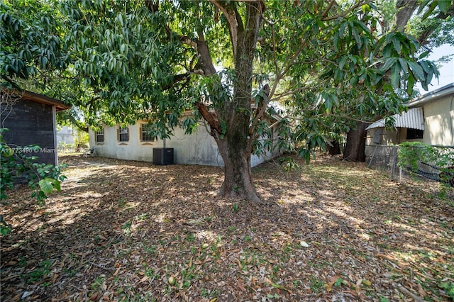 85 NW 165th St, Miami, FL 33169 - view of yard with central air condition unit and fence