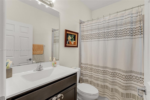 bathroom with a shower with shower curtain, toilet, and vanity